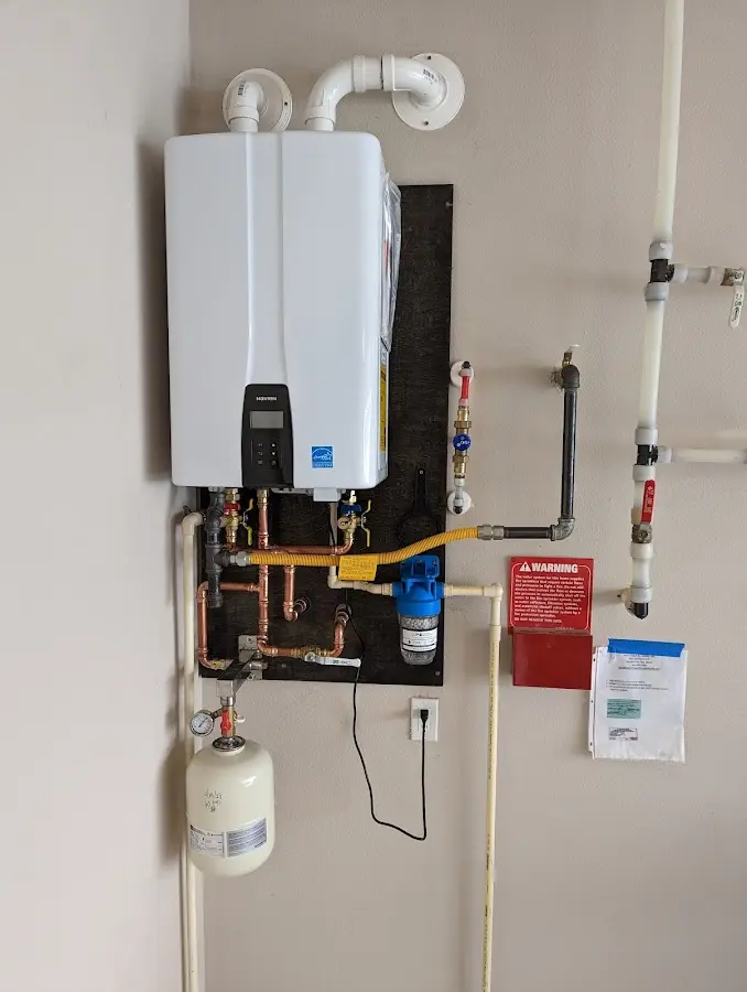 Professional plumber installing copper piping in a Imlay home